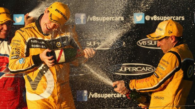 Breakthrough success: James Moffat and Michael Caruso celebrate winning race 25 of the V8 Supercar Championship Series at Winton Motor Raceway.