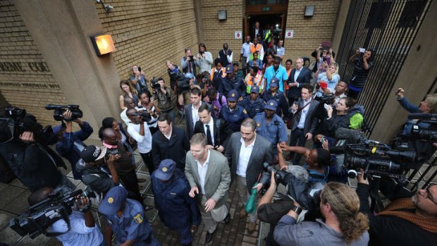 Accused of murder: South African Oscar Pistorius leaves North Gauteng High Court at the end of the third day of his trial.