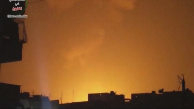 The sky is lit up after an explosion at what Syrian state television reported was a military research centre in Damascus.