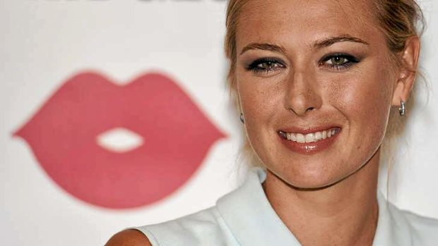 Sharapova smiles at a launch of her new candy brand 'Sugarpova' in London before this year's Wimbledon.