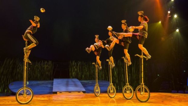 Balance: A troupe of Mongolian girls performing with metal bowls on top of two-metre-high unicycles.