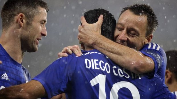 Got their man: Chelsea's new signing Diego Costa with Chelsea teammates Gary Cahill and John Terry.