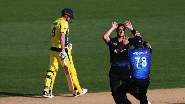 Rough day: New Zealand bowler Matt Henry celebrates the wicket of Shaun Marsh at Eden Park.