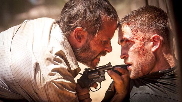 Strange and disturbing: Guy Pearce and Robert Pattinson in <em>The Rover</em>.