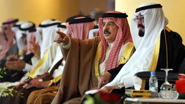 Allies ... Saudi Arabia's King Abdullah,  right, and Bahrain's King Hamad bin Isa Al Khalifa   watch a camel race near Riyadh during the  annual Jenadriyah cultural festival.
