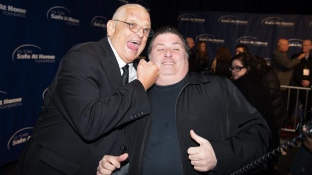Dusty Rhodes with photographer Dave Allocca in 2014.