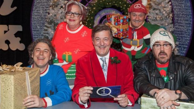 Host Stephen Fry and the panel for this year's <i>QI</i> Christmas special.