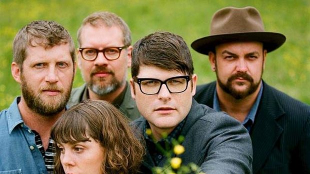 Mellow yellow ... frontman Colin Meloy, with flowers, and fellow Decemberists.
