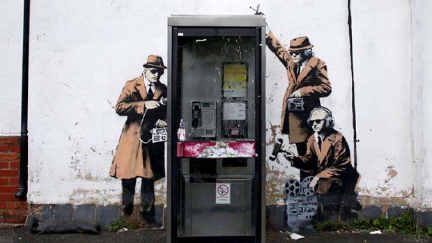 Banksy owns up to this graffiti street art on the side of a house in Cheltenham.