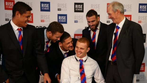 Strong bond: Alex McKinnon, Knights teammates and coach Wayne Bennett share a joke at the launch of the Rise For Alex fund.