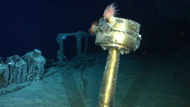 Images released by Odyssey Marine Exploration show, top, a stern compass, a water closet and a staircase of the wreck of SS Gairsoppa.