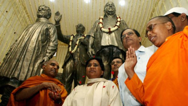 Glory... Kumari Mayawati at a ceremony in New Delhi in 2007 in front of statues of herself and the Dalit heroes B.R. Ambedkar and Kanshi Ram.
