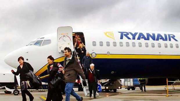 Ryanair is being investigated for flying planes with exit row seats empty after passengers refused to pay extra to sit in the seats.
