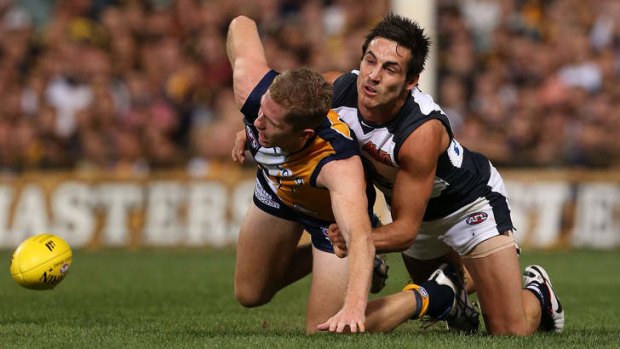Kane Lucas of the Blues tackles Adam Selwood of the Eagles.