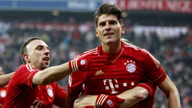 Bayern Munich's Mario Gomez celebrates with teammates.