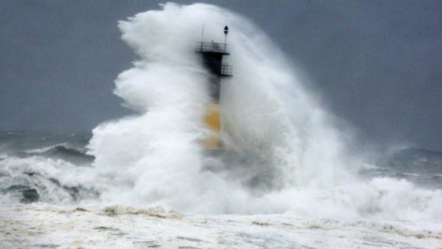 A hugeh wave hits a lighthouse as Typhoon Neoguri approaches the Korean Peninsula in Seogwipo on Jeju Island, South Korea