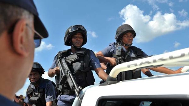 South African police enter the farm of slain white supremacist leader Eugene Terre'Blanche in Ventersdorp.