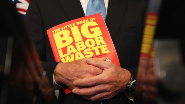 Literary creation: Tony Abbott clutches his new effort.