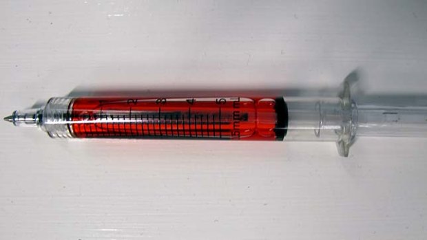 The syringe-like pen used by the Brisbane food outlet to promote its burgers.