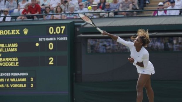 Disoriented ... Serena Williams struggles to get her serve over the net before retiring due to illness.