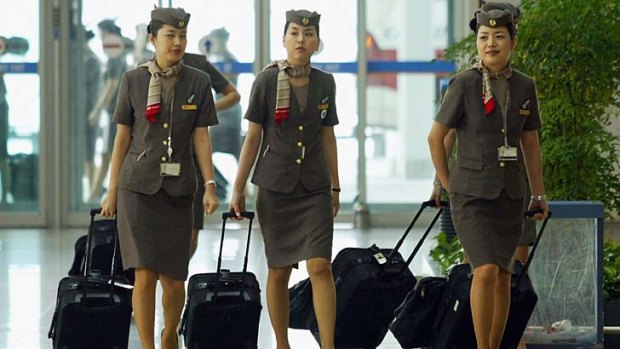 Skirts optional ... Asiana flight attendants have won the right to wear pants.