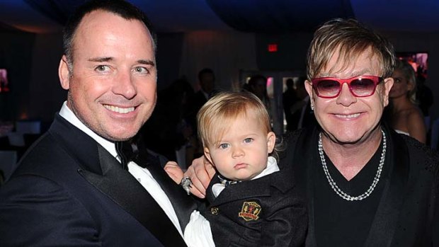 Happy family ... Sir Elton John has reportedly become a father for a second time via a surrogate who gave birth to their son Zachary, pictured, two years ago.