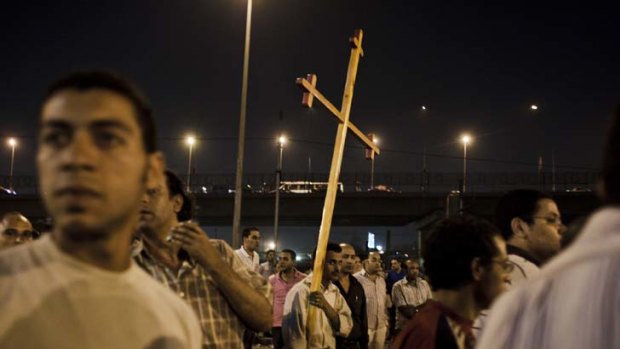 Unbowed ... Coptic Christians protest outside the Cairo Coptic Hospital the day after 25 Coptic Christians were killed by the army.