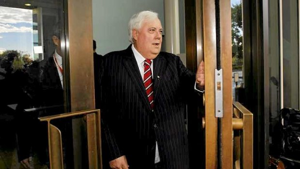 New door opens: Clive Palmer arrives for the opening of Parliament.