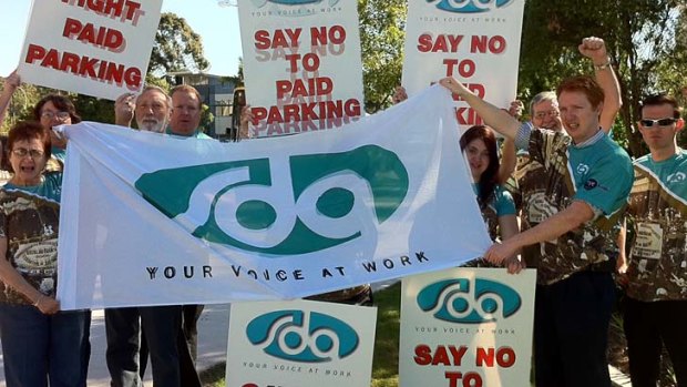 Retail union members protest the introduction of paid parking at Westfield Carindale.