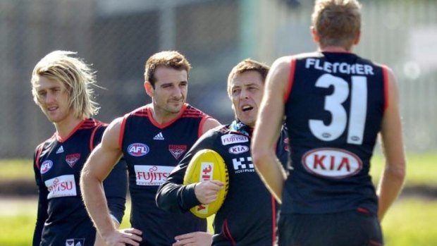 Dyson Heppell (far left) says Dustin Fletcher (far right) is no certainty of returning