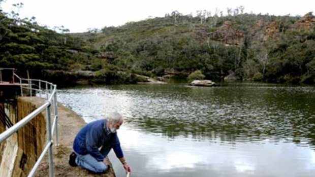 Correlation  . . . environmentalist Chris Jonkers tests the salinity of the water at Farmers Creek Dam, Lithgow.
