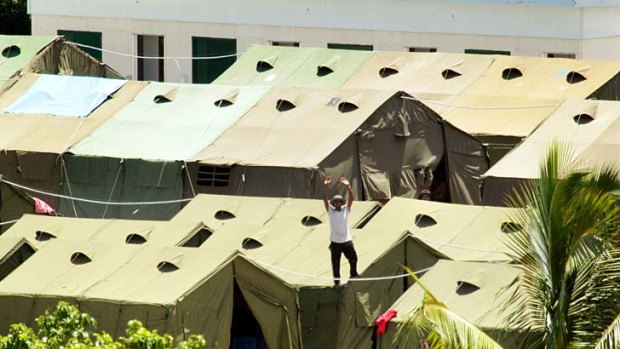 Suspicions ignored: The detention centre where Amnesty International says men live in hot, leaky tents.