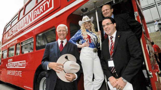 Bob on the job … (from left) Katter, Rodeo Queen of Australia Courtney McGeechan, Shane Knuth (top) and Adrian McLindon by a KAP campaign bus.