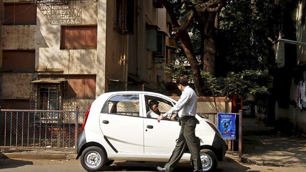 Small but well formed &#8230; a Nano parked in Mumbai. About 10,000 Nanos are sold in India each month.