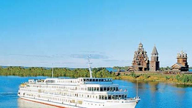 Old Russia ... the Viking Surkov passes the wooden buildings of Kizhi Island.