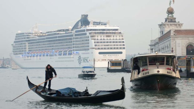 The MSC Magnifica cruise liner ship passes near St Mark's square in Venice's basin.