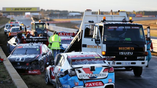 The cars are cleared at Symmonds Plains after a crash in Saturday's Supercars event. 