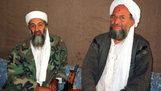 Zawahri (right) with Osama bin Laden. America is 'still killing Muslims' he says in the video.