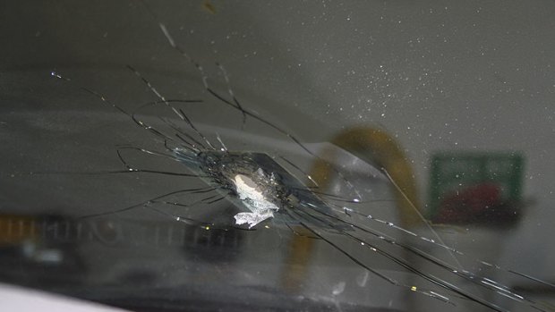 The bullet hole in the driver's window of Loukman Abdul-Rahman's car.