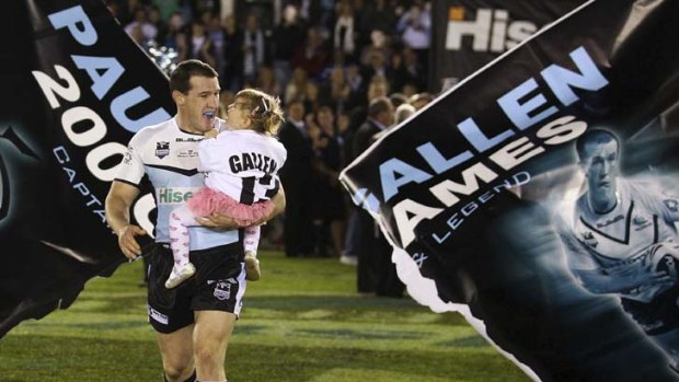 One-club man ... Paul Gallen runs out for his 200th match with daughter Charly.