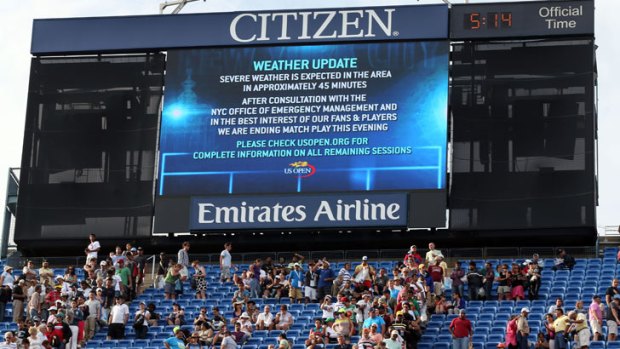 A severe weather warning posted on the big screens at the US Open in New York, where the men's semi-final had to be postponed.