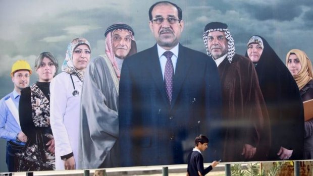 Political interference: Iraqi Prime Minister Nouri al-Maliki, seen here at the centre of an election poster in Baghdad, is accused of using electoral law to bar his rivals from office.