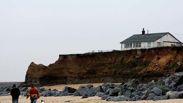 Continued erosion has left Happisburgh homes like those of Nigel Cutting in desperate danger of falling into the Norfolk sea.