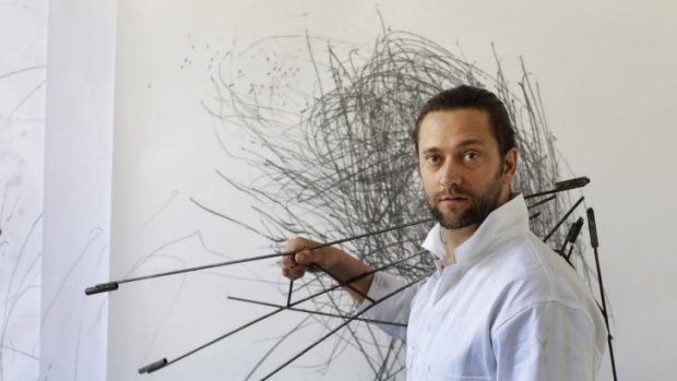 Former Slacker artist Chris Fox with his work, Instrument and Drawing, in his studio at the Sydney College of the Arts.