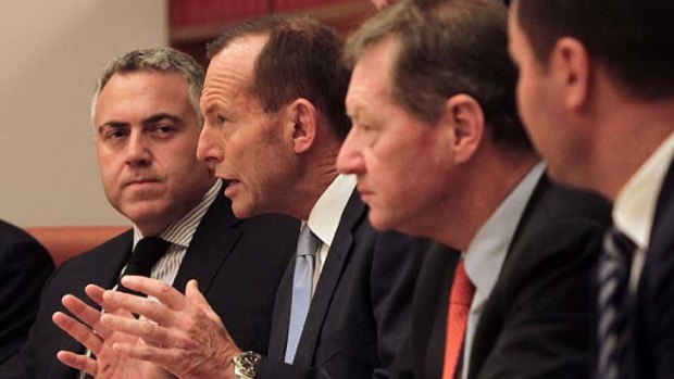 Serious talks: Joe Hockey and Tony Abbott in cabinet on Monday.