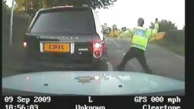 Camera footage of former policeman Mike Baillon attacking the car of a pensioner who failed to stop his car after being caught speeding.