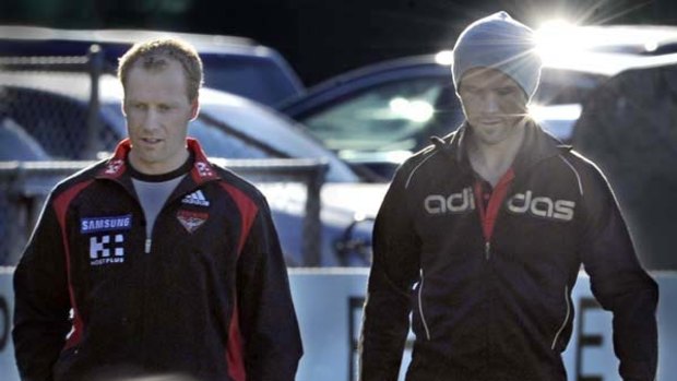 Coach Matthew Knights and Mark McVeigh at Essendon's recovery session yesterday.