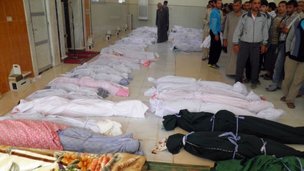 A handout picture released by the Syrian opposition's Shaam News Network shows the bodies of 92 people including 32 children before their burial in the central Syrian town of Houla on May 26, 2012.