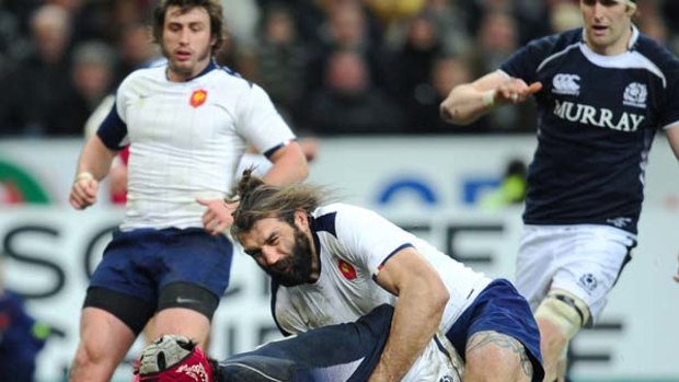 Kelly Brown scores for Scotland despite the tackle of Sebastien Chabal.