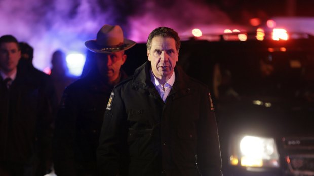 New York Governor Andrew Cuomo arrives to the site of a collision between a train and vehicle in Valhalla, New York.